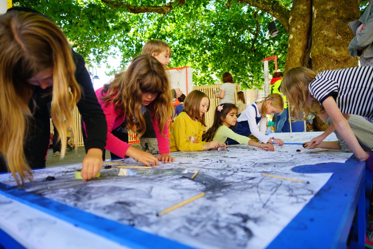Younger children building drawing machines at a Forest of Imagination creative youth development workshop